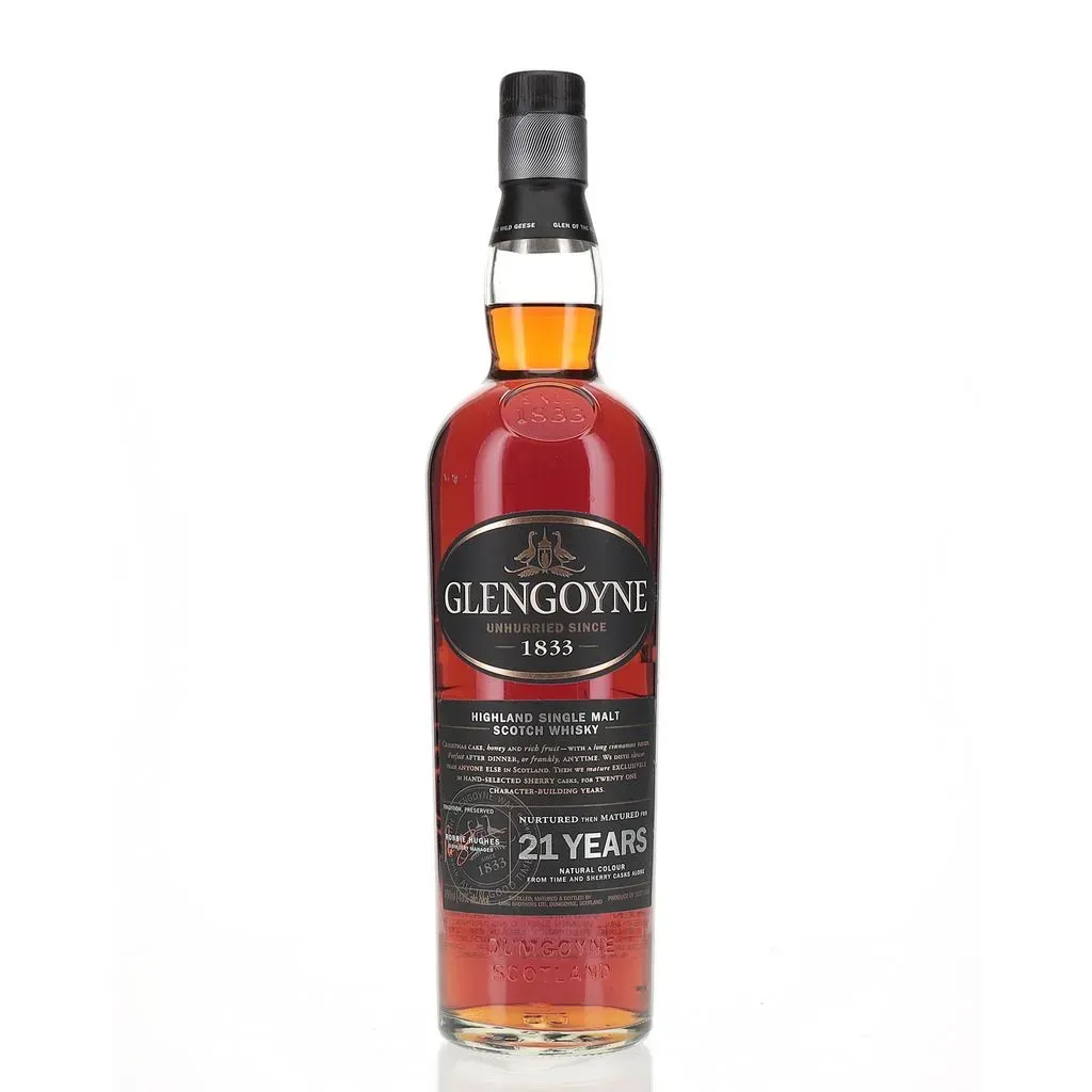 Nestled in the serene landscape of Dumgoyne Hill in the Southern Highlands, Glengoyne Distillery has honed its artistry over two centuries, and this expression epitomizes its mastery.

Aged to perfection for 21 years in the finest oak casks, this whisky exudes a rich, amber hue that hints at the depth of flavor within. As the golden liquid cascades into your glass, it releases an enchanting bouquet of aromas — from sweet toffee and ripe apples to hints of oak and subtle spices, each layer inviting you to explore further.

On the palate, Glengoyne 21 Year Old unfolds with grace and complexity. Silky smooth, yet robust, it tantalizes your taste buds with notes of creamy caramel, dried fruits, and gentle sherry undertones, all interwoven with a touch of nuttiness and warming spices that linger long after each sip.

With each indulgent taste, Glengoyne 21 Year Old reveals the culmination of time, patience, and expertise that define the Glengoyne legacy. Whether savored neat or with a splash of water, it offers a truly remarkable whisky experience, a testament to the artistry and dedication of Scotland's renowned whisky makers.