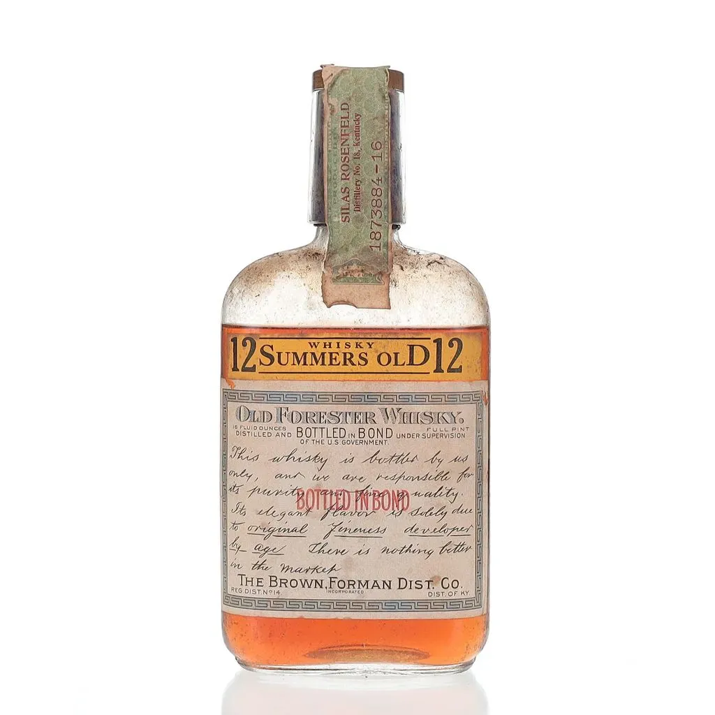 The Old Forester 12 Summers Old Bottled In Bond 1929 is a remarkable snapshot of bourbon history, encapsulating the quality and tradition of one of America's oldest bourbon brands. Bottled in bond under strict government supervision, this whisky adheres to the standards set forth in the Bottled-in-Bond Act of 1897, ensuring its purity and authenticity. The label on this well-preserved bottle proudly declares its 12-year aging process and the commitment of the Brown-Forman Distillery to its craft. The amber color of the whisky hints at its maturity and depth of flavor, likely offering a rich, complex profile typical of bourbons from this era. This bottle is not only a testament to the enduring legacy of Old Forester but also a rare collectible that represents the storied past of American whiskey-making.