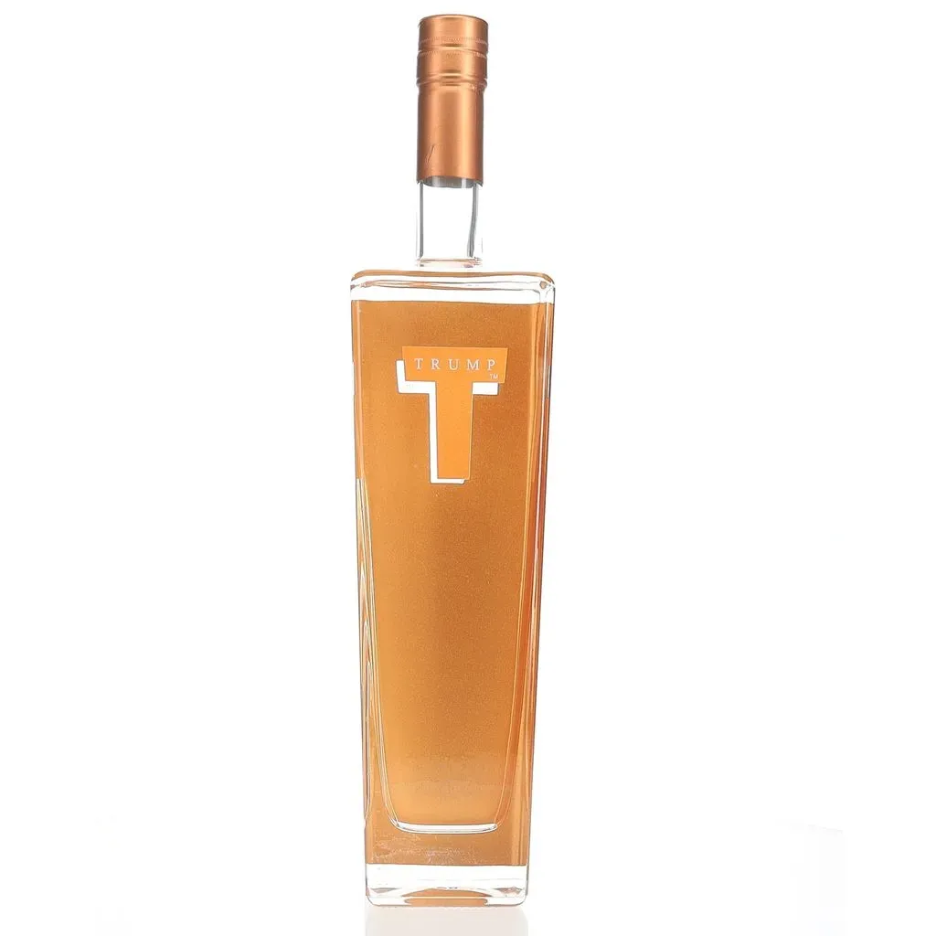 Trump Super Premium Vodka is a distinctive spirit that was once associated with the brand of former U.S. President Donald Trump. Created in Holland by Wanders Distillers, this vodka is crafted from select European wheat and undergoes a meticulous production process.

The vodka is distilled five times, with four of these distillations utilizing activated carbon for enhanced purity. Following distillation, it's rested for six months in stainless steel vats, allowing the flavors to meld and develop complexity.

On the nose, Trump Super Premium Vodka offers dry, earthy scents of grain and paraffin, complemented by subtle notes of jasmine, flowers, moss, and a hint of soot. The palate presents a better-than-average grain focus and viscosity, evolving into an off-dry profile with intense breakfast cereal and biscuit-like flavors. The finish is described as oily/creamy with a snack cracker-like quality.

Launched in 2005 with the slogan "Success Distilled," this vodka was initially promoted as a luxury brand aimed at competing with established premium vodkas. However, despite its initial fanfare, Trump Vodka was discontinued in the United States in 2011 due to poor sales performance. It's worth noting that the brand continues to have a presence in certain international markets, particularly in Israel, where it has found popularity around the Jewish holiday of Passover.