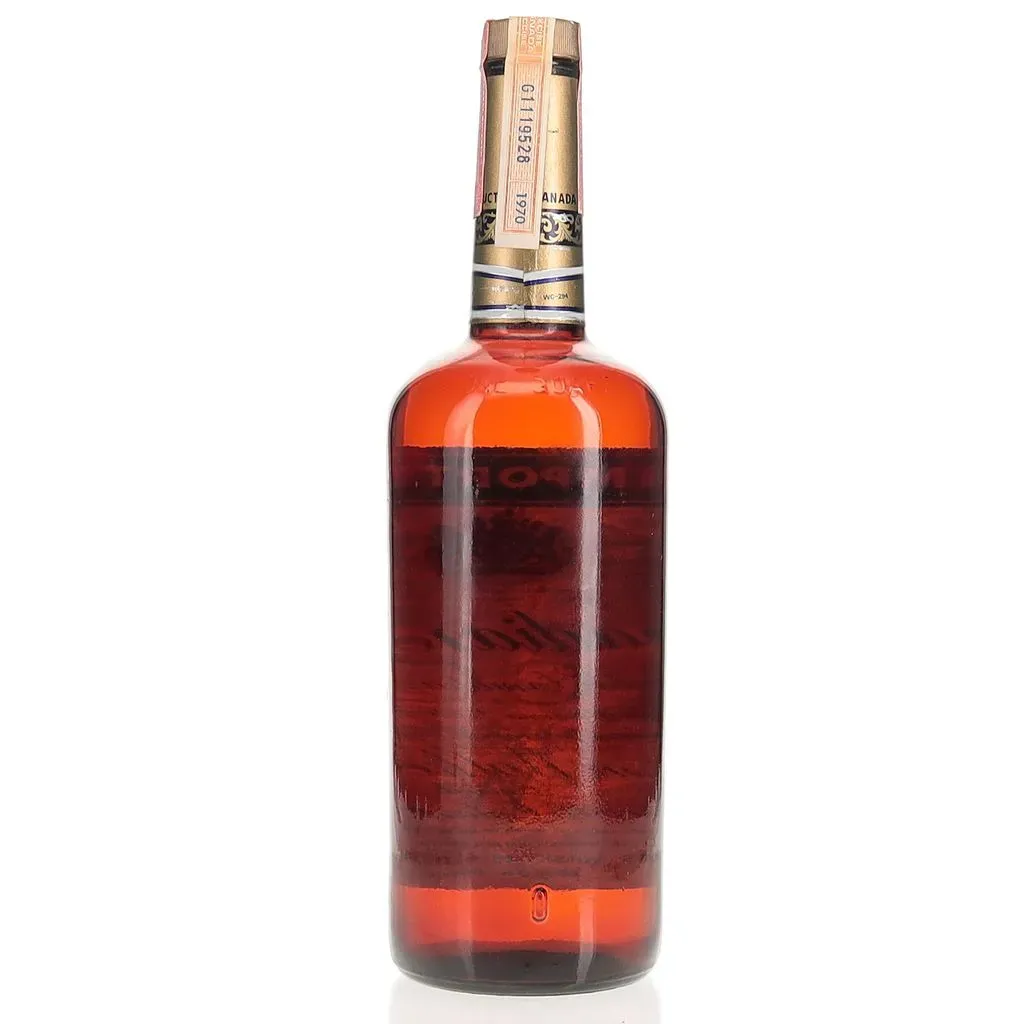 A 1970 vintage 6 year old expression of Canadian Club produced by Hiram Walker and bottled in a 1 quart format.