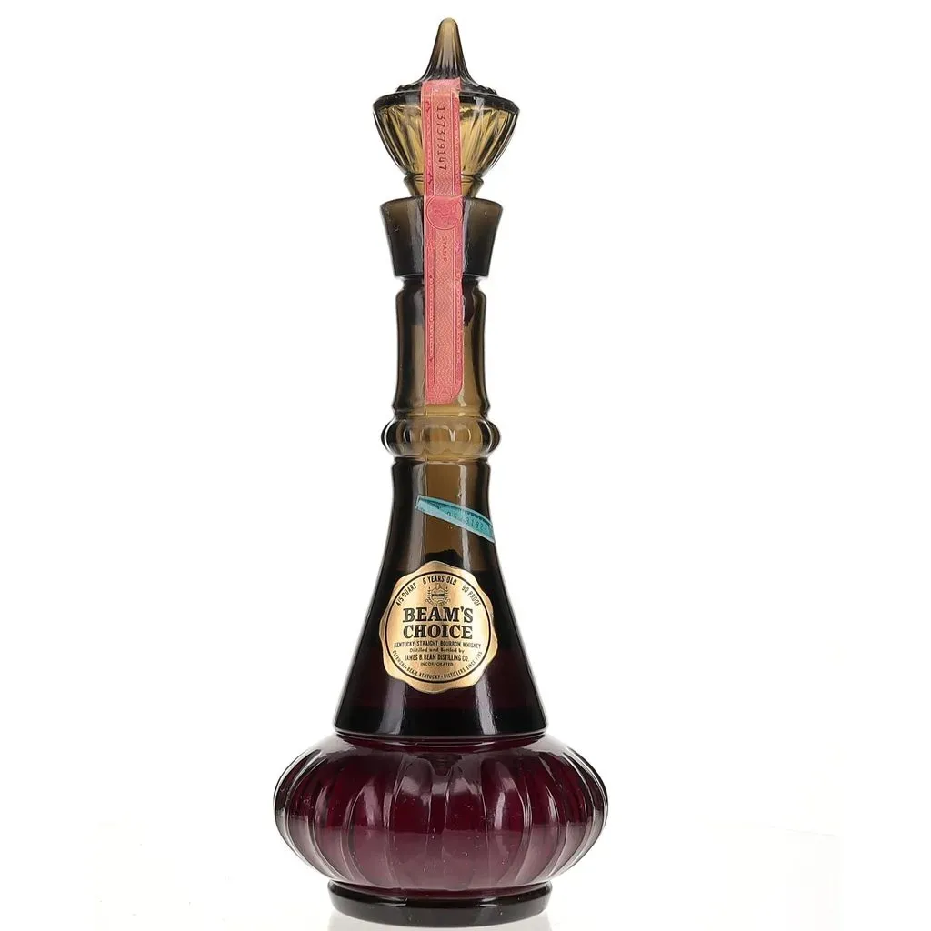 A 1964 bottling of Jim Beam matured for 6 years and bottled in a smoke green genie bottle decanter. This 1964 glass decanter was the same one used for the hit series 'I Dream Of Jeannie'. More info about the production history of the series and the bottles association can be found in this Forbes article: https://www.forbes.com/sites/robertanaas/2017/04/25/i-dream-of-jeannie-home-a-jim-beam-whiskey-bourbon-bottle-expected-to-fetch-100000-at-auction/