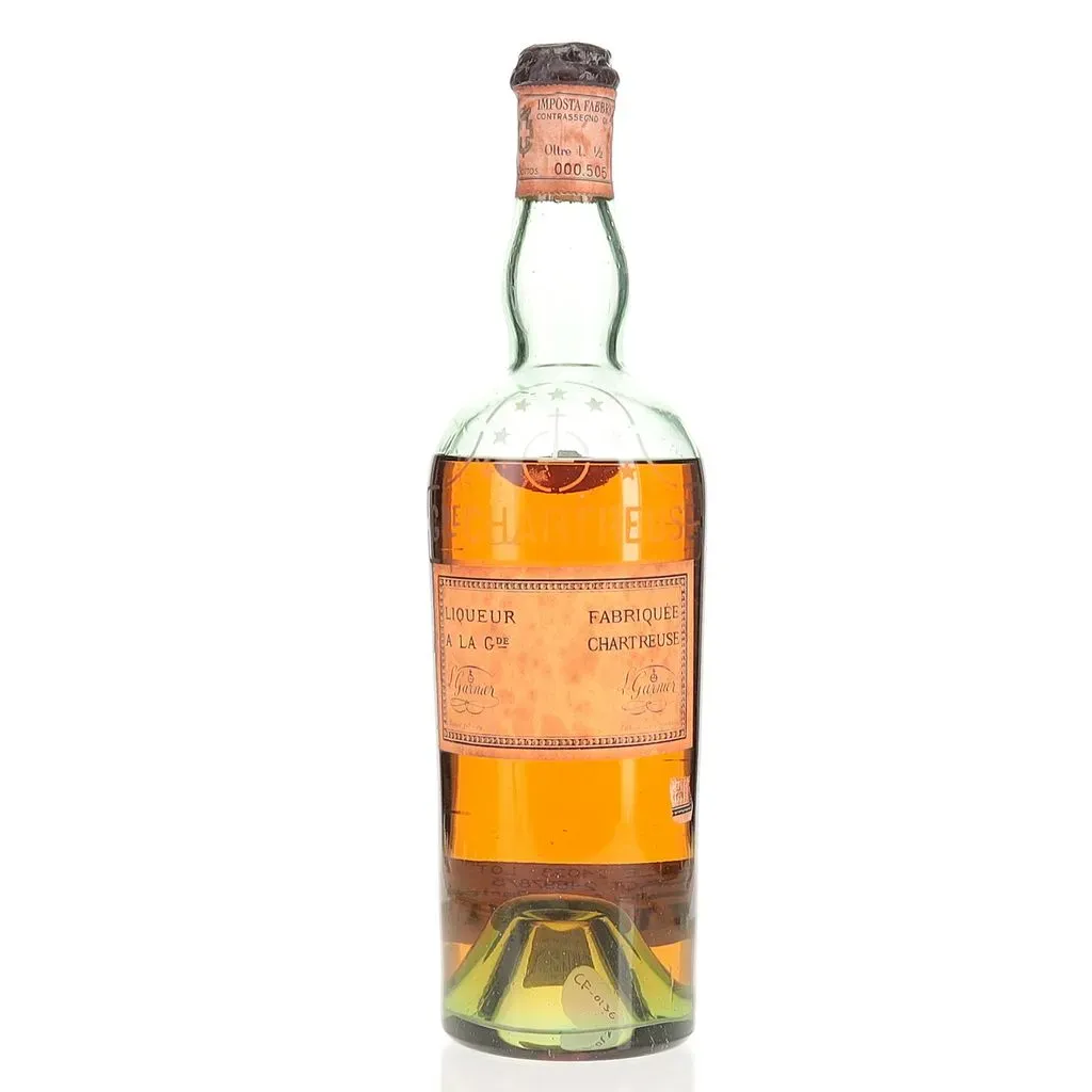 A circa early to mid 1940s bottling of Yellow Chartreuse.. Older expressions of Chartreuse are highly sought after as the liqueur actively eats sugar, mellowing over time and creating an exceptionally rich and decadent spirit. Chartreuse has been made by French monks for close to two centuries now, with the recipe a close guarded secret. The monks have been forced into exile at various times in the past, moving production to Spain at one point. This is a half liter sized bottling likely bottled around 40-43% Abv.